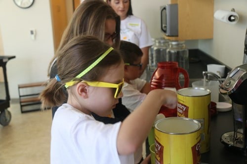 opening cans of lemonade
